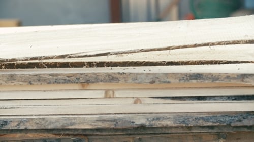 Stacked Lumber Planks in a Woodshop