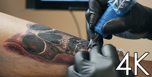 Tattoo Artist Creating Skull Tattoo Close Up