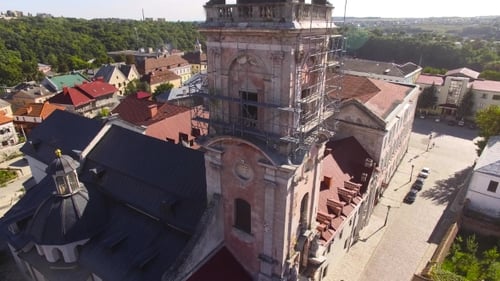 Aerial View Over Cathedral On Countryside In Mountains At Sunset