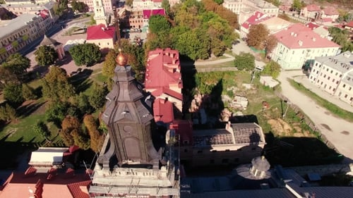 AERIAL: Rising Up Over European City At Sunset