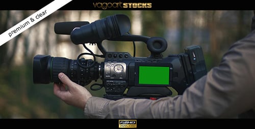 Camera on Tripod Being Adjusted Outdoors