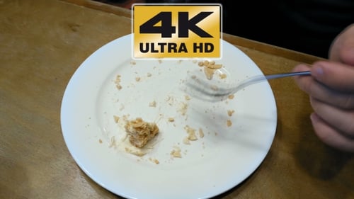 Eating Dessert Remains with Fork