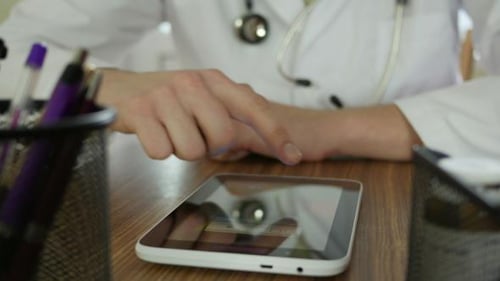 Doctor Using Tablet