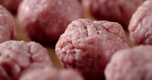 Close Up of Fresh Raw Meatballs on Wood