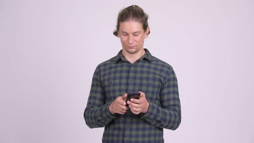 Young Adult Typing on Smartphone