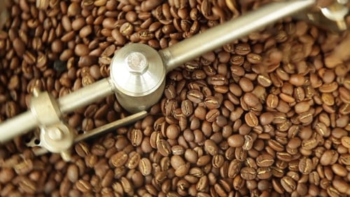 Close Up Coffee Beans Being Roasted in Machine