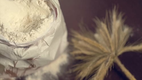 Flour and Wheat on a Dark Surface
