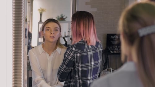 Applying Makeup With Brushes in Bright Salon