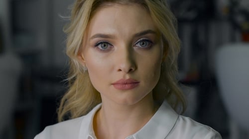 Beautiful Blonde With Make-up And Hairstyle, Looking Into The Camera.