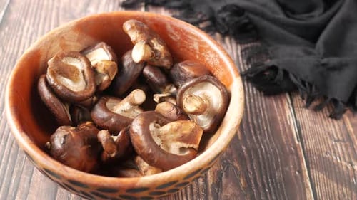 Raw Champignon Mushroom in a Bowl on Table