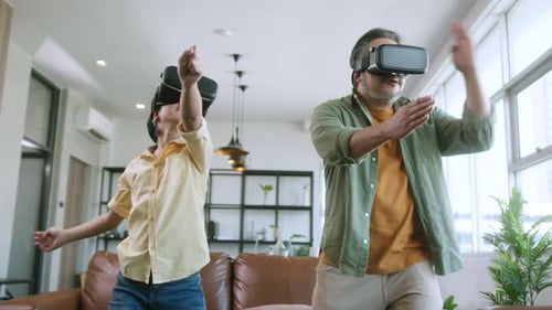 Dad and Child Enjoying VR Headsets at Home