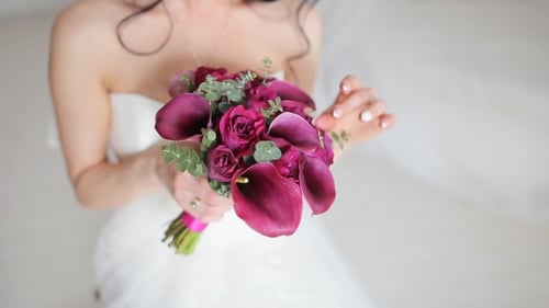 Bride Holds Burgundy, Pink, and Purple Wedding Bouquet