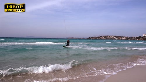 Kite Surfer Rides the Turquoise Ocean Waves