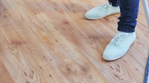 Mop Cleaning a Wooden Floor Close Up