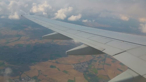 Aerial View From The Airplane On Cumulus Clouds