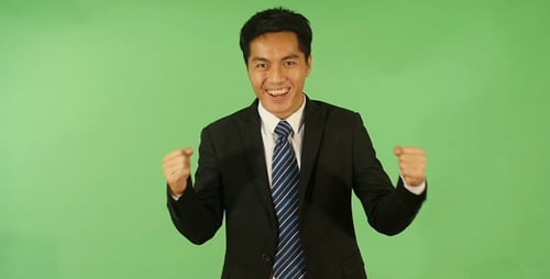 Enthusiastic Man Gesturing in Front of Green Screen