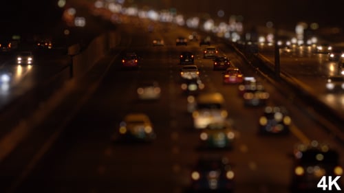 Traffic Drives on Highway at Night Miniature Effect