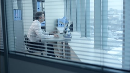 Man Working at Computer in Modern Office