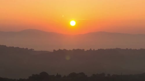 Scenic Sunrise or Sunset Over Mountain Landscape