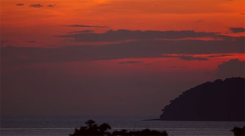 Fiery Sunset Over Tropical Ocean Coastline