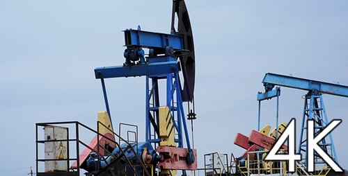 Oil Pumps Extracting Resources in Rural Landscape