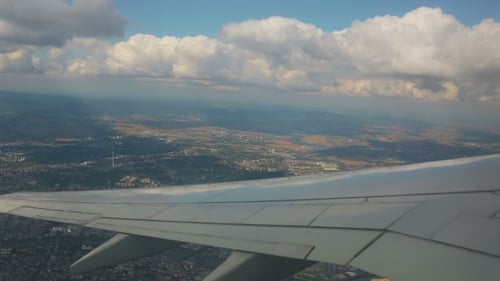 Aerial View From The Airplane On Cumulus Clouds