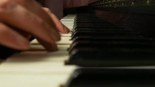 Hands Playing Piano Keyboard Close Up