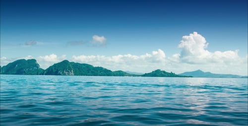 Island From A Boat With Clouds