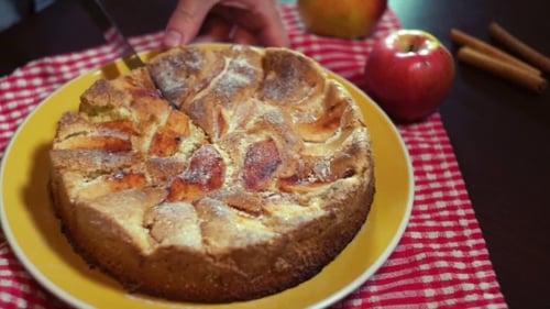 Cutting a Freshly Baked Apple Pie