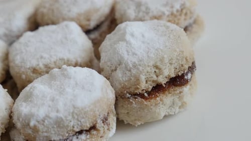 Jam Filled Cookies Topped with Powdered Sugar