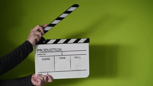 Human Hands Hold and Clap with Clapperboard