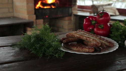 Grilled Sausages with Vegetables and Fire Oven
