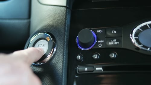 Finger Activates Car Start Stop Button on Dashboard