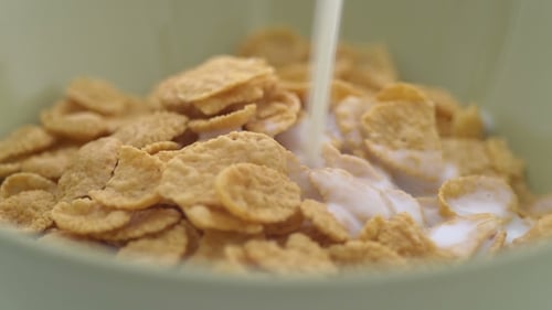 Milk Poured into Corn Flakes for Breakfast