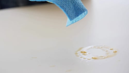 Cleaning a clear spill with a cloth