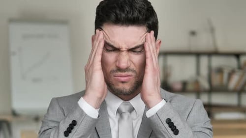 Businessman Experiencing Severe Headache