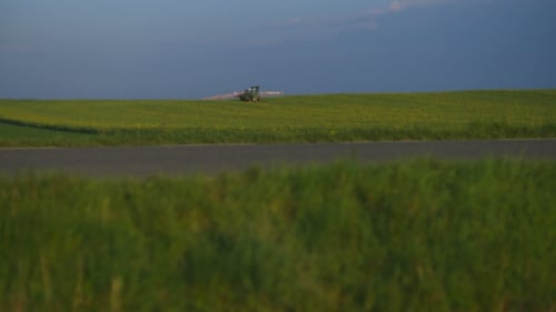 Tractor Spray Fertilize On Field With Chemicals In Agriculture Field.