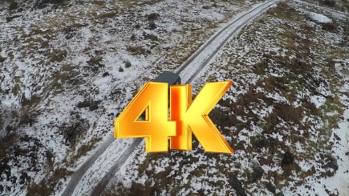 Van Driving on Snow Covered Road Aerial