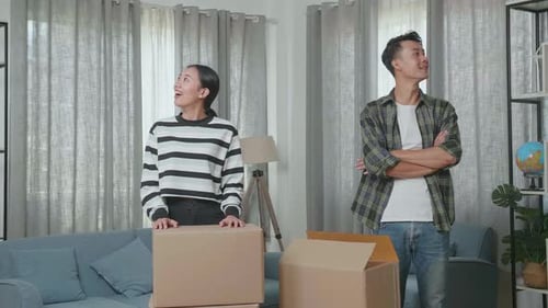 Couple Moves Boxes into New Home Together