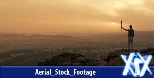 Sunrise Cityscape: Mountain Peak with Torch Silhouette