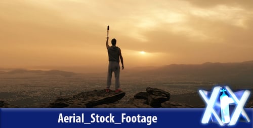 Man with Torch on Mountain Peak at Sunrise