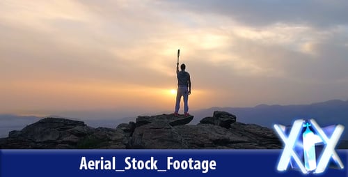 Silhouette of Person on Mountain During Epic Sunrise
