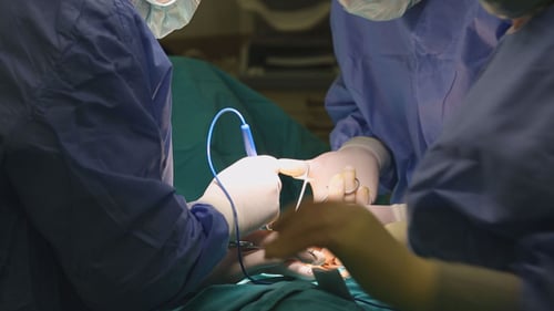 Medical Professionals Performing Surgery in Operating Room