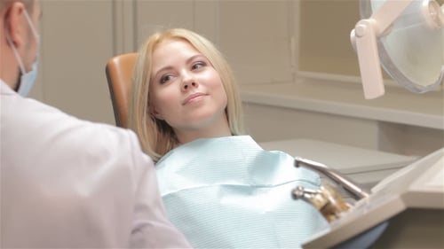Young Woman Patient Smiling During Dental Checkup