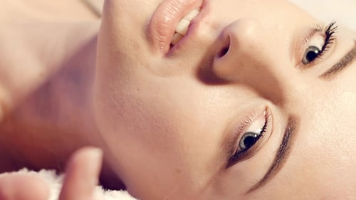 Woman Lying Down Smiling Beautifully
