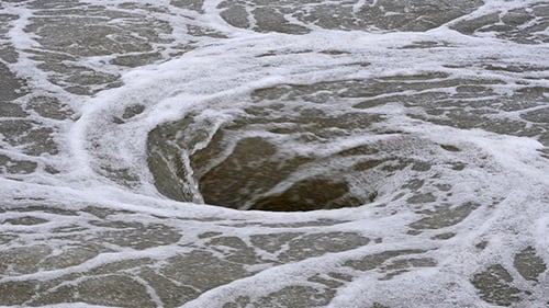 Swirling Water Forming a Natural Vortex