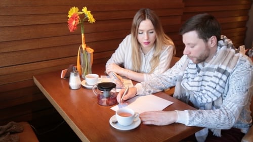 Creative Team At Work In a Cafe