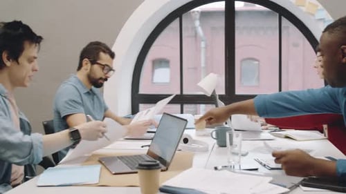 Team Discussing Business at Modern Office Workplace