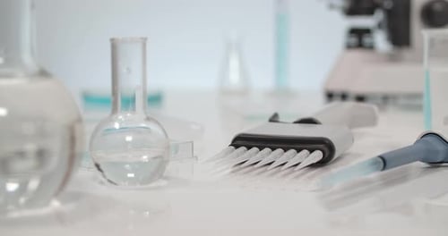 Laboratory Glassware and Instruments on a Clean Bench