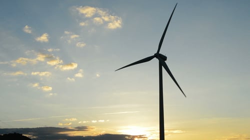Wind Turbine Moving at Sunset